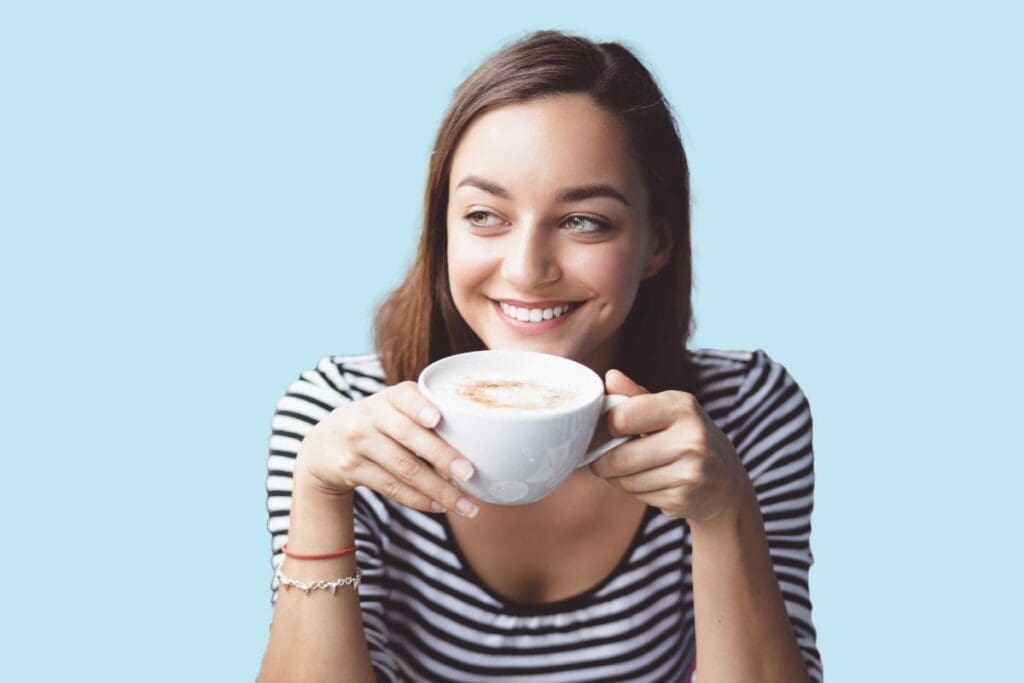 Girl smiling with a cup of coffee